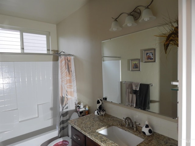 bathroom with vanity and shower / bath combination with curtain