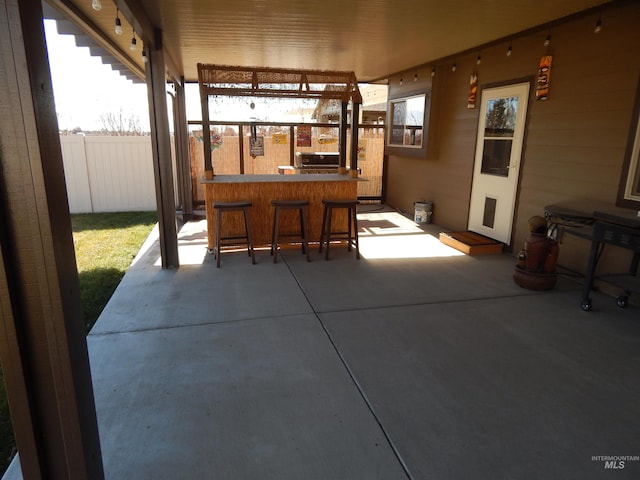 view of patio / terrace featuring an outdoor bar