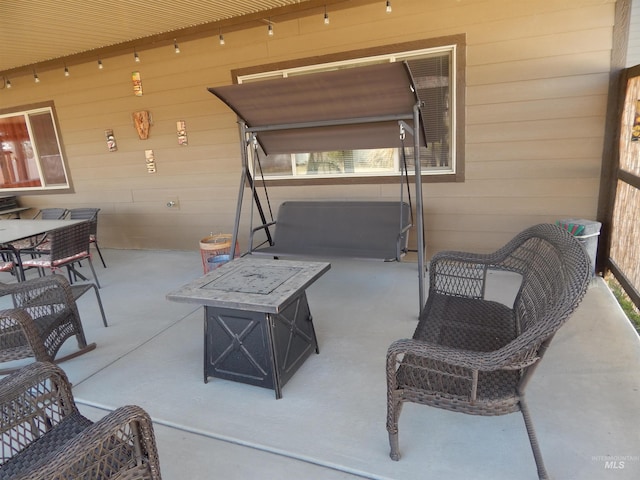 view of patio with a fire pit