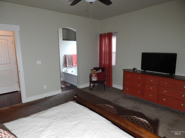 bedroom featuring light carpet, connected bathroom, and ceiling fan