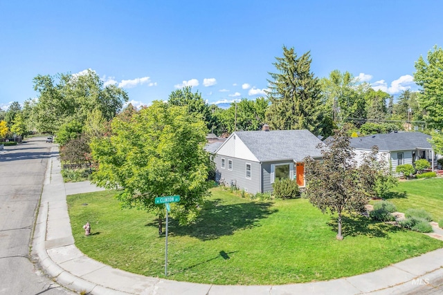 4224 W Clinton St, Boise, ID 83706 - view of property exterior with a lawn and a chimney