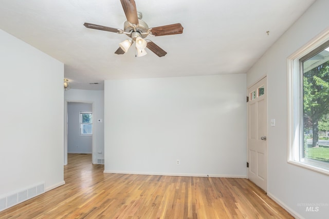 4224 W Clinton St, Boise, ID 83706 - empty room featuring light wood-type flooring, baseboards, and a ceiling fan