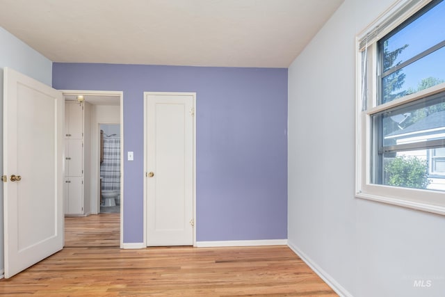 4224 W Clinton St, Boise, ID 83706 - unfurnished bedroom with light wood finished floors and baseboards