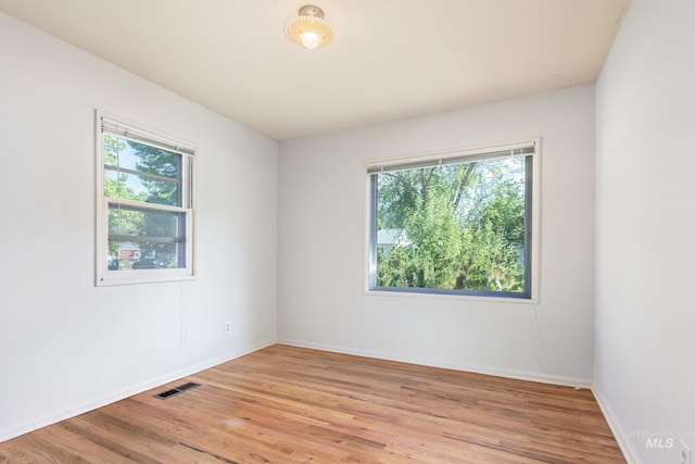 4224 W Clinton St, Boise, ID 83706 - unfurnished room featuring plenty of natural light, light wood-type flooring, and baseboards