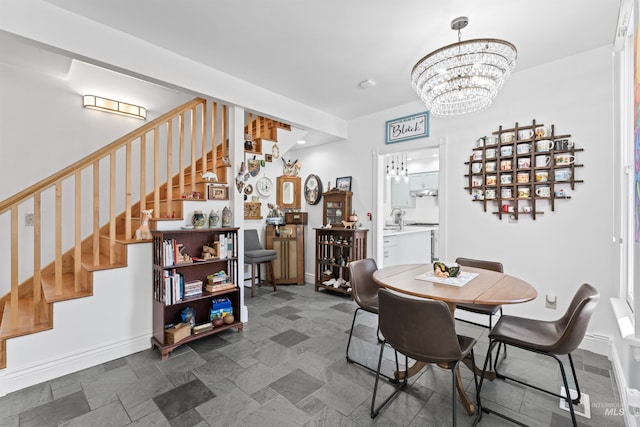 1416 N 13th St, Boise, ID 83702 - dining space with stairway, baseboards, and a notable chandelier
