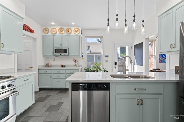 1416 N 13th St, Boise, ID 83702 - kitchen with a sink, stainless steel appliances, decorative light fixtures, recessed lighting, and a peninsula