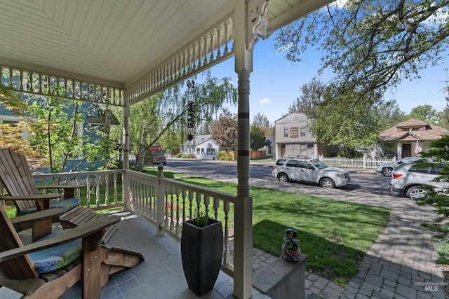 1416 N 13th St, Boise, ID 83702 - view of patio featuring a porch and a residential view