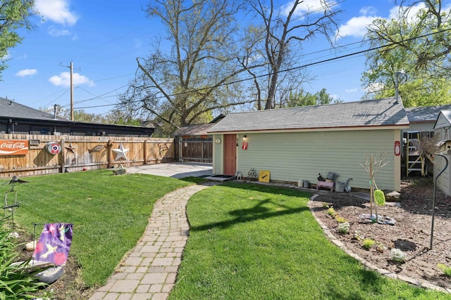 1416 N 13th St, Boise, ID 83702 - view of yard featuring an outbuilding, a fenced backyard, and a patio area