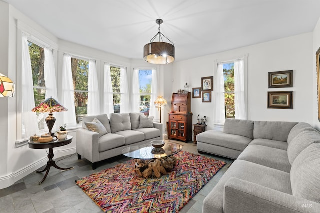 1416 N 13th St, Boise, ID 83702 - living room featuring baseboards and stone finish flooring