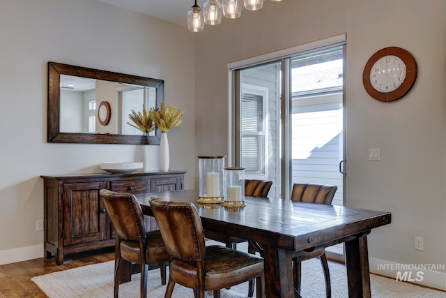 dining area with hardwood / wood-style floors