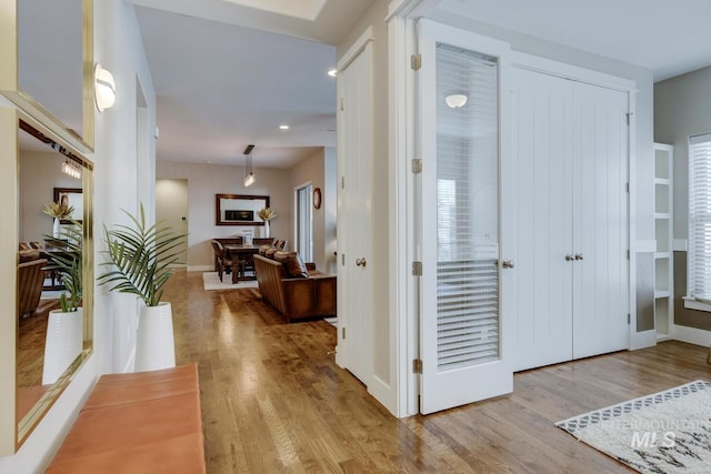 hall with light hardwood / wood-style flooring