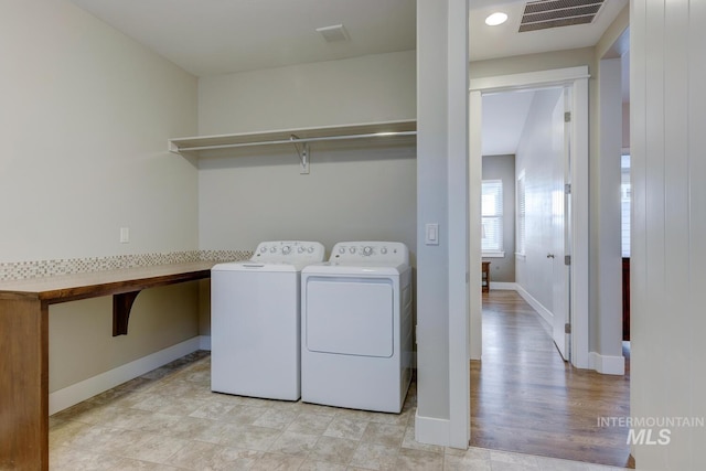 washroom featuring independent washer and dryer