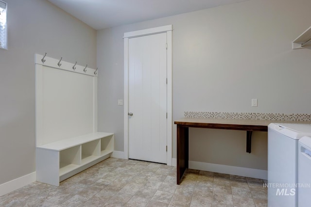 mudroom with separate washer and dryer