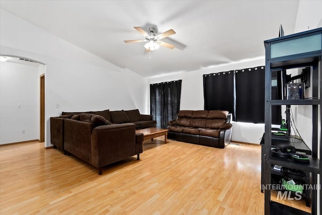 living room with light hardwood / wood-style floors and ceiling fan