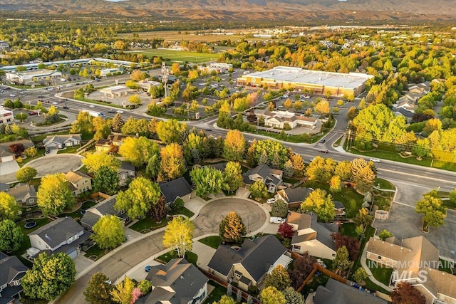 aerial perspective of suburban area with a mountainous background