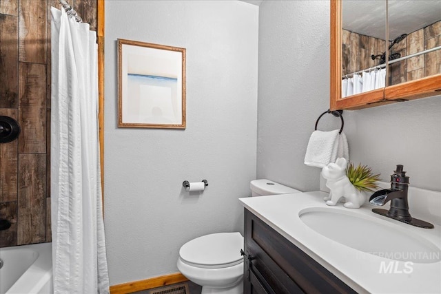 9 Elderberry Cir, Idaho City, ID 83631 - full bathroom with toilet, vanity, shower / tub combo, and a textured wall