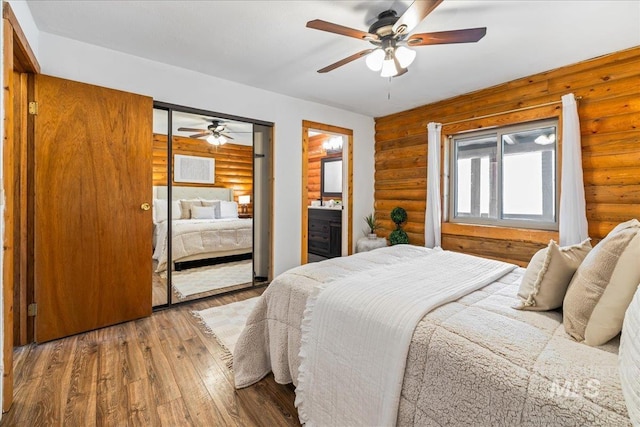 9 Elderberry Cir, Idaho City, ID 83631 - bedroom featuring rustic walls, wood-type flooring, a ceiling fan, and a closet