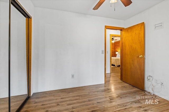 9 Elderberry Cir, Idaho City, ID 83631 - unfurnished bedroom with a closet, wood finished floors, and ceiling fan