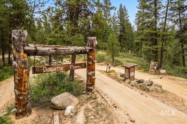 9 Elderberry Cir, Idaho City, ID 83631 - view of patio / terrace featuring driveway and a wooded view