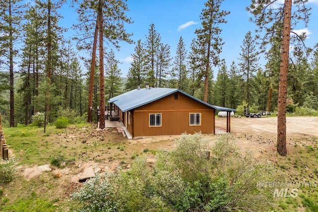 9 Elderberry Cir, Idaho City, ID 83631 - view of side of home with a view of trees and driveway