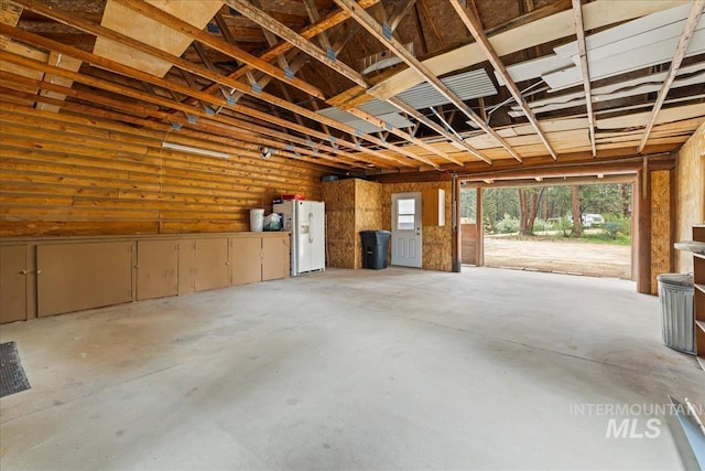 9 Elderberry Cir, Idaho City, ID 83631 - garage featuring white refrigerator with ice dispenser