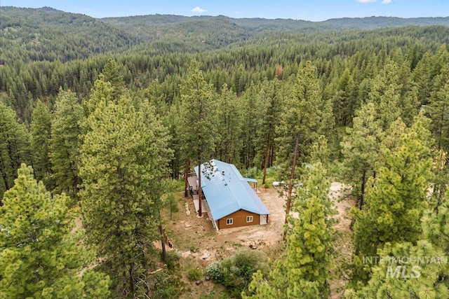 9 Elderberry Cir, Idaho City, ID 83631 - aerial view of property and surrounding area featuring a heavily wooded area and a mountain backdrop