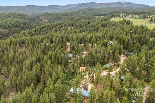 9 Elderberry Cir, Idaho City, ID 83631 - aerial overview of property's location with a heavily wooded area and a mountainous background