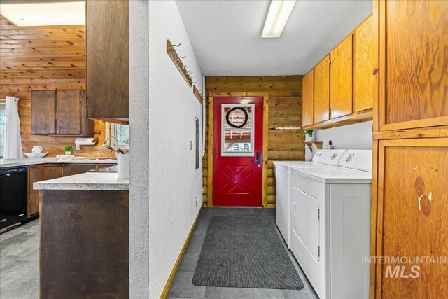9 Elderberry Cir, Idaho City, ID 83631 - laundry room with separate washer and dryer, log walls, cabinet space, and baseboards