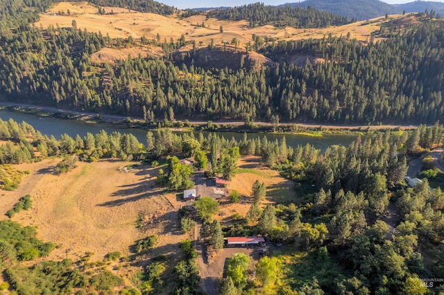 aerial view featuring a water and mountain view