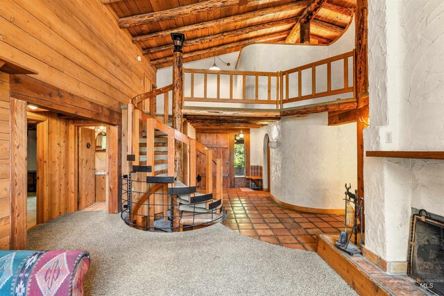 hallway with wooden ceiling, vaulted ceiling with beams, and carpet flooring