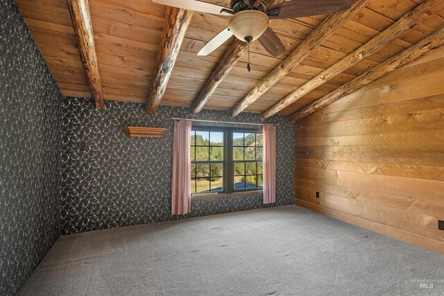 interior space with light carpet, tile countertops, wood walls, vaulted ceiling with beams, and wooden ceiling