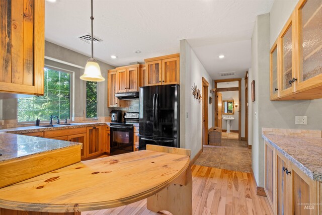 laundry room with separate washer and dryer, a textured ceiling, cabinets, and sink