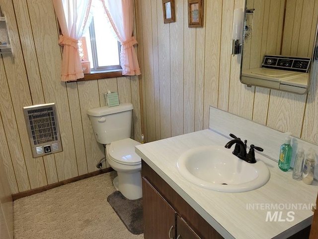 607/611 S Main St, Cascade, ID 83611 - half bath featuring heating unit, vanity, and wooden walls