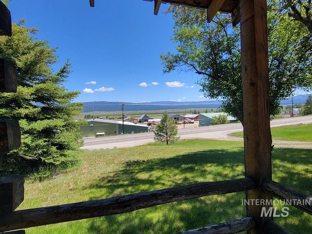 607/611 S Main St, Cascade, ID 83611 - view of grassy yard featuring a mountain view