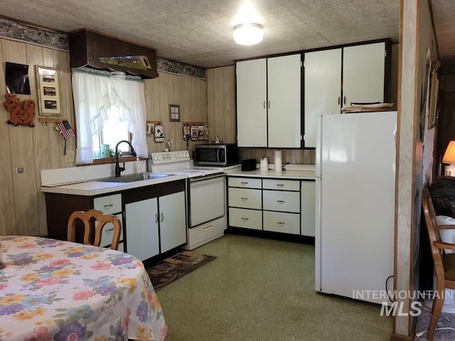 607/611 S Main St, Cascade, ID 83611 - kitchen featuring white appliances, light countertops, and white cabinetry