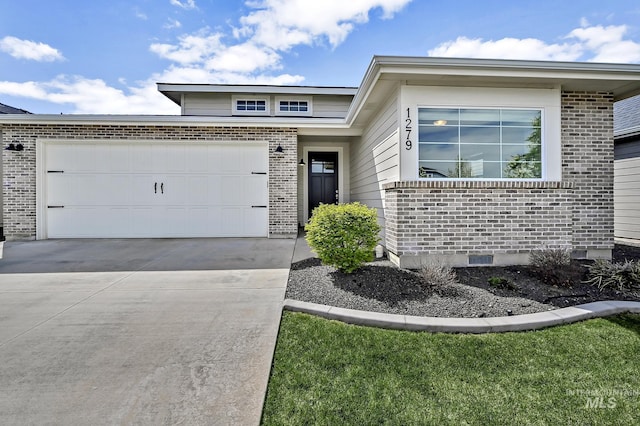 1279 W Bolton, Eagle, ID 83646 - view of front facade with brick siding, a garage, and driveway