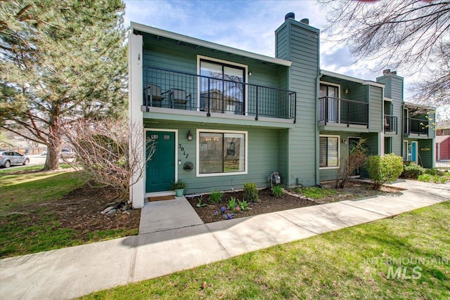 3017 S Windstream Ln, Boise, ID 83706 - townhome / multi-family property featuring a balcony and a chimney