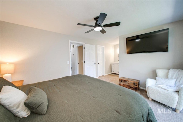 3017 S Windstream Ln, Boise, ID 83706 - carpeted bedroom with connected bathroom, ceiling fan, and baseboards