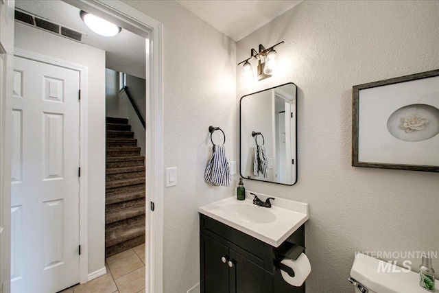 3017 S Windstream Ln, Boise, ID 83706 - bathroom featuring tile patterned flooring, vanity, and toilet