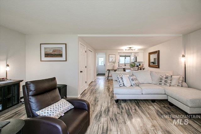 3017 S Windstream Ln, Boise, ID 83706 - living room featuring wood finished floors and baseboards