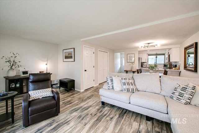 3017 S Windstream Ln, Boise, ID 83706 - living area featuring wood finished floors and baseboards