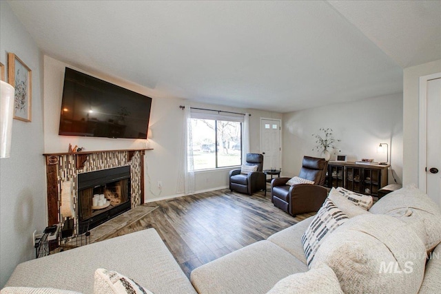 3017 S Windstream Ln, Boise, ID 83706 - living room with wood finished floors, a fireplace, and baseboards