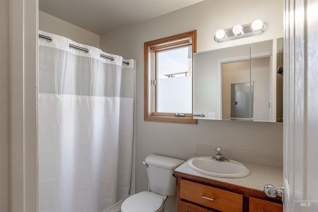 bathroom with vanity, toilet, and a shower with curtain