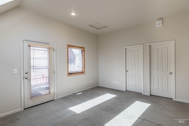 unfurnished bedroom featuring baseboards, recessed lighting, carpet, and access to outside