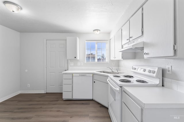 kitchen with dark wood-style floors, light countertops, a sink, white appliances, and under cabinet range hood