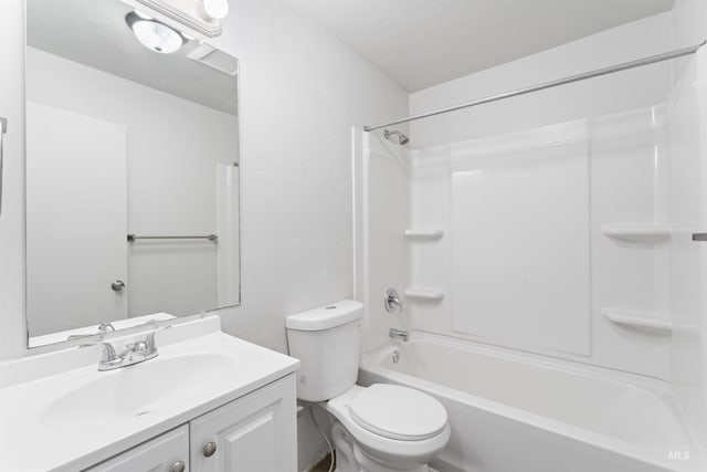 full bathroom with toilet, bathing tub / shower combination, and vanity