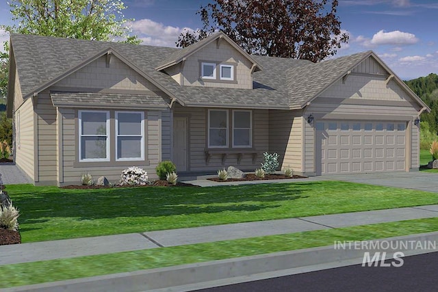 view of front of home featuring a front yard and a garage