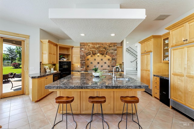 3586 N Croft Way, Eagle, ID 83616 - kitchen featuring a sink, paneled built in fridge, a textured ceiling, open shelves, and tasteful backsplash