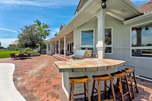 3586 N Croft Way, Eagle, ID 83616 - view of patio / terrace featuring an outdoor kitchen and a baseboard radiator