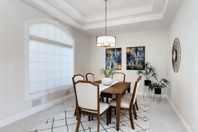 3586 N Croft Way, Eagle, ID 83616 - dining space with light colored carpet, a tray ceiling, and baseboards